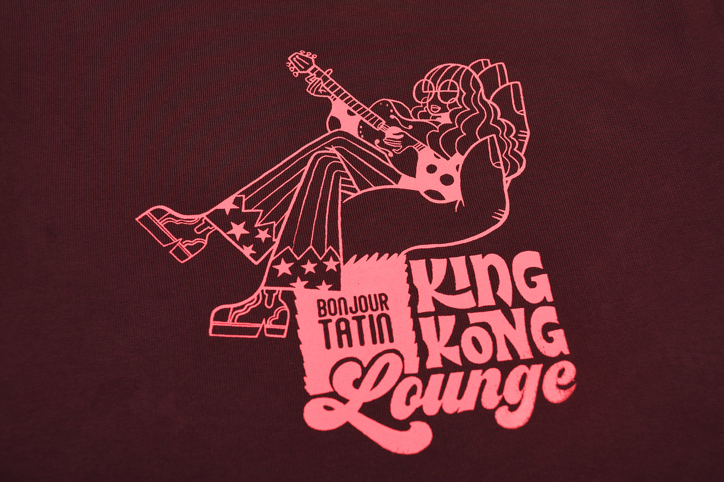 burgundy red sweater with a graphic pink print of King Kong.