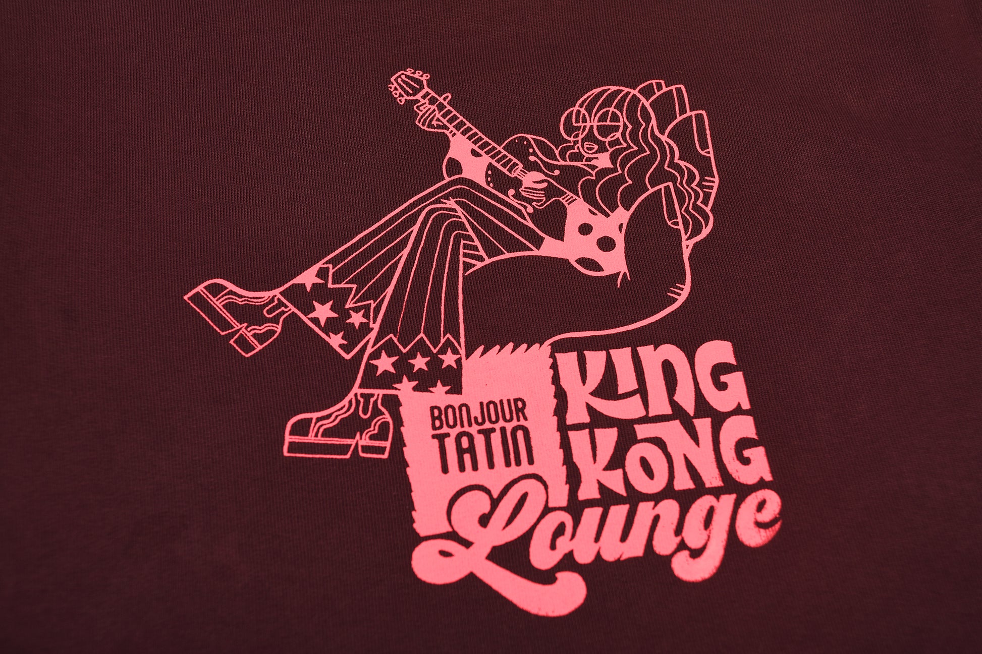 burgundy red sweater with a graphic pink print of King Kong.