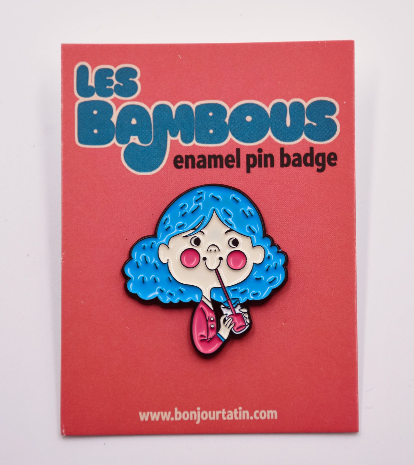Illustration of a girl drinking lemonade pin red blue les on red card