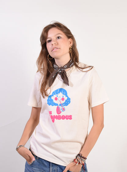 Person wearing a white t-shirt with a colorful graphic design on a plain background