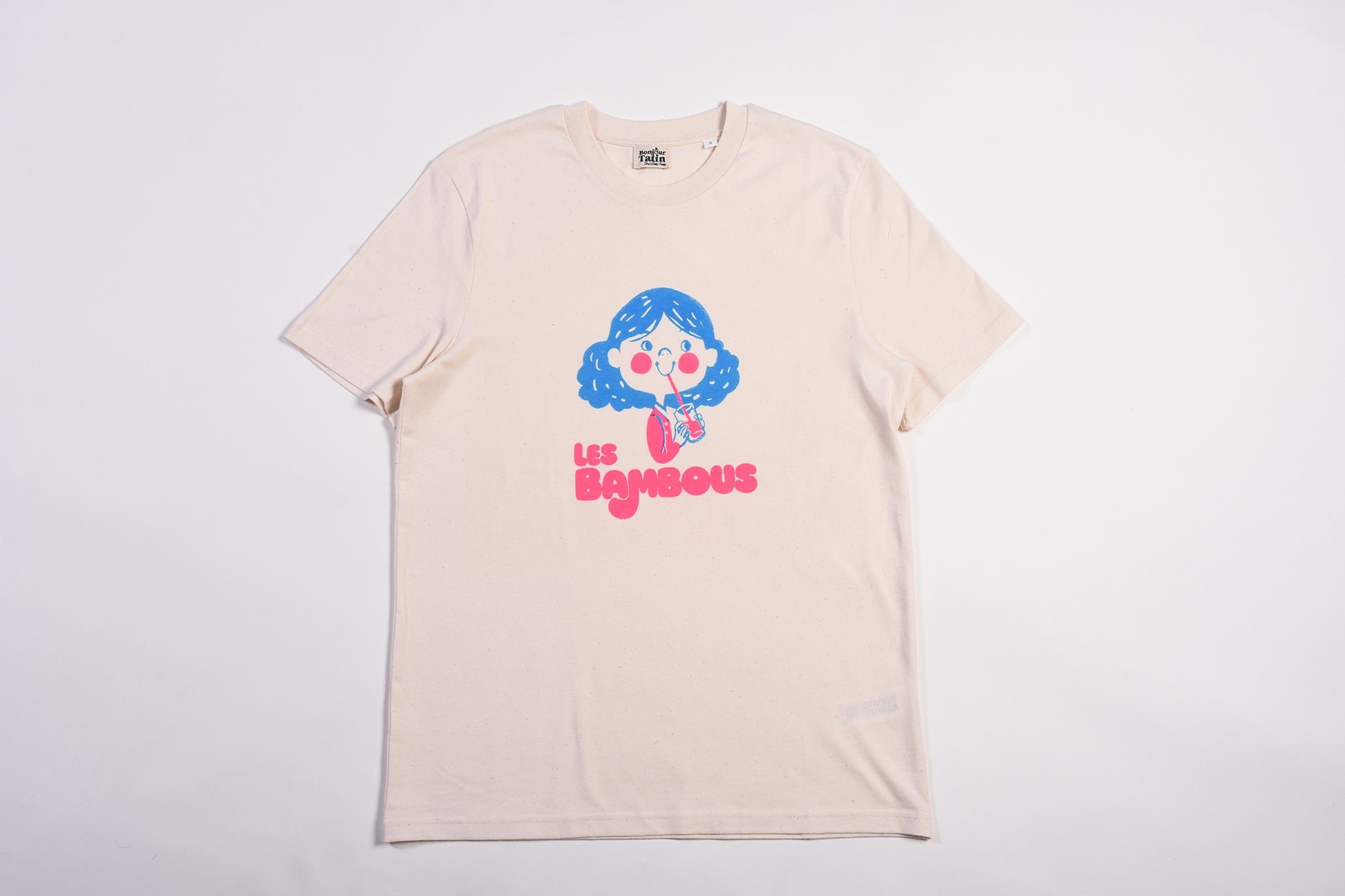 Beige t-shirt with a colorful graphic and text on a white background